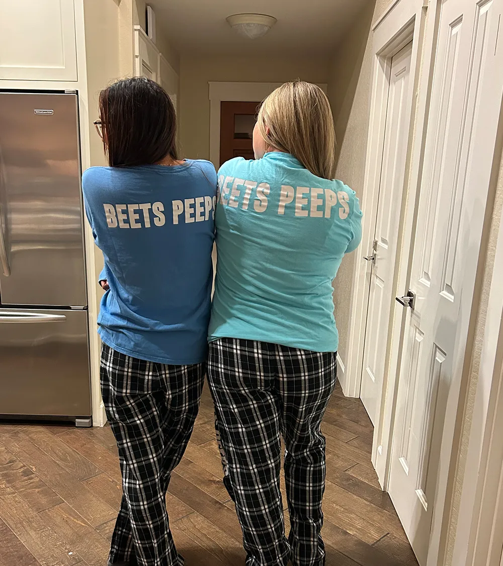 Two team members wearing Beets Peeps shirts