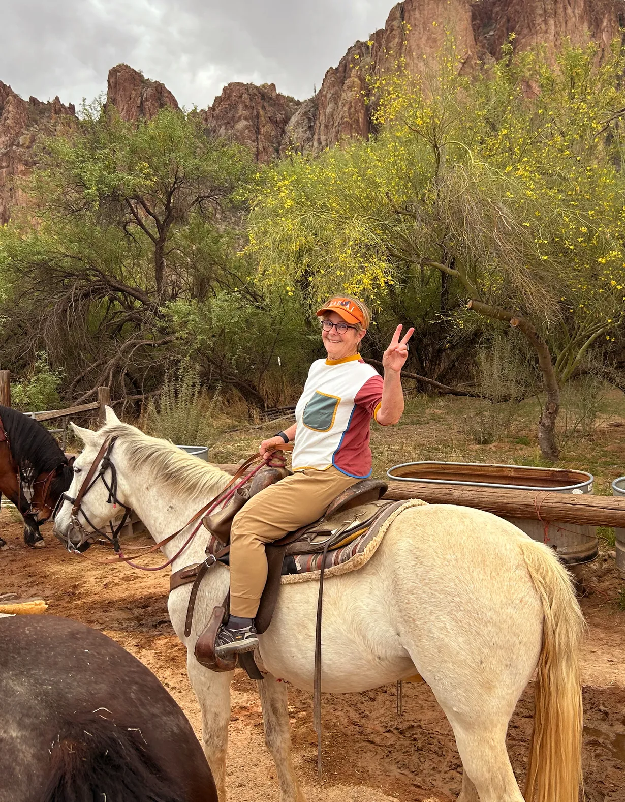 Read Phillips riding a horse giving a peace sign